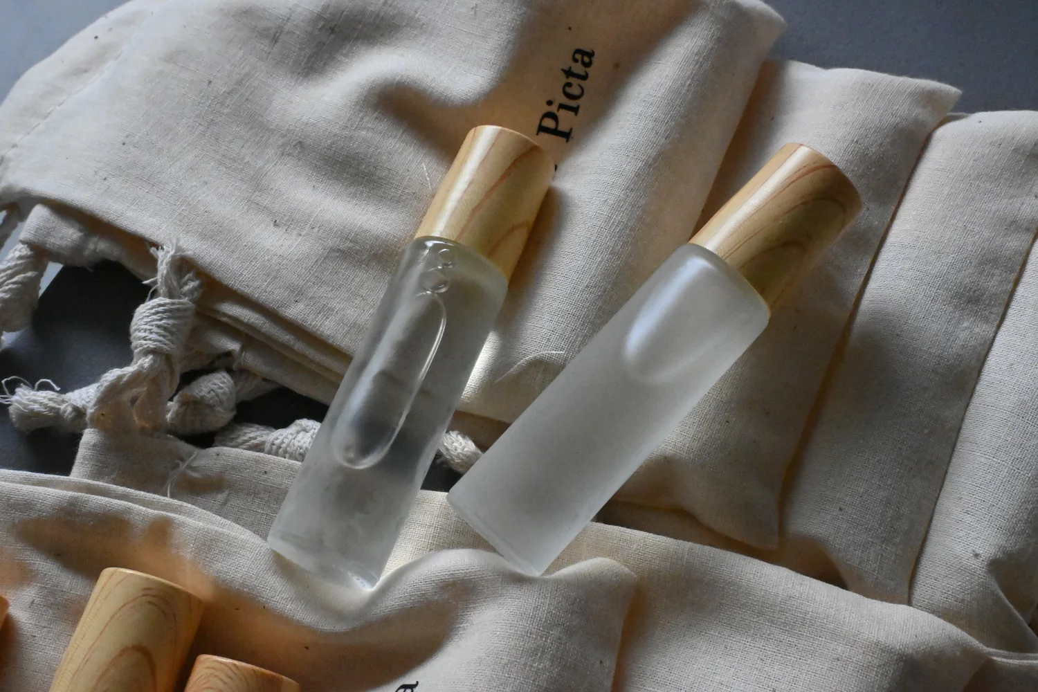 Real photo of perfume oil on fabric pouches